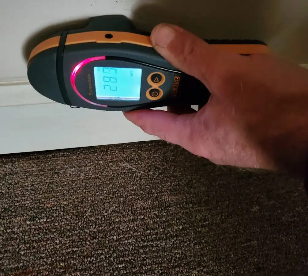 Moisture detection at baseboard during Storm Damage Restoration in Chico